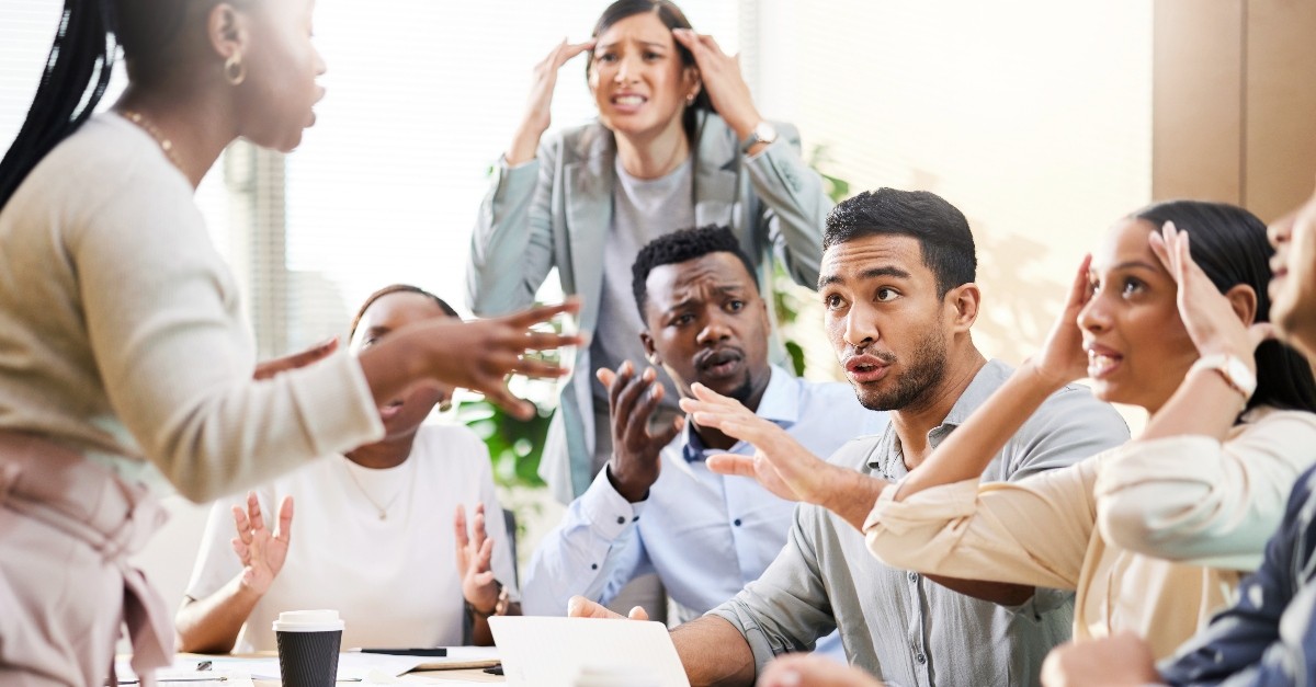 People disagreeing in an office