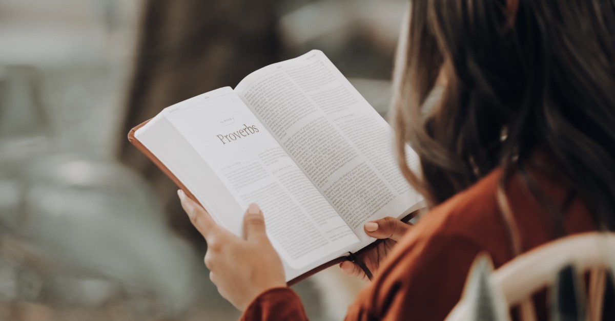 woman reading the Bible, psychical Bibles are the most popular format to consume the Good News